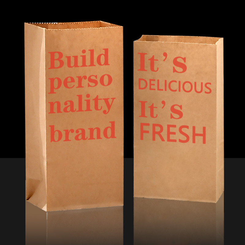 Two complete brown paper bags without handles with red printed text